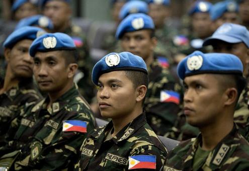 بازگشت سربازان پاسدار صلح کلاه آبی فیلیپینی از بلندی های جولان به فرودگاه مانیل./AFP
