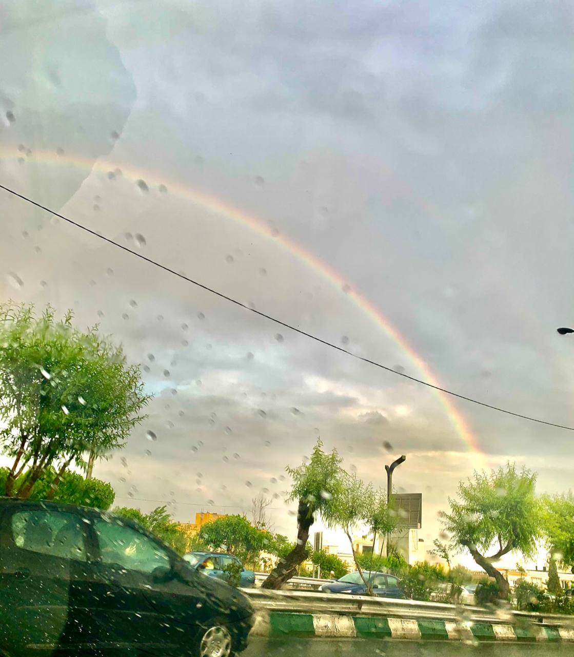 رنگین‌کمان زیبا در تهران بارانی‌