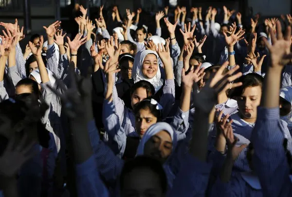 مراسم استقبال از دانش آموزان فلسطینی در مدرسه سازمان ملل در غزه./AFP
