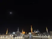 عکس | ماه‌گرفتگی در آسمان حرم امام رضا (ع)