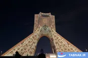عکس: نمایش فرش‌های نفیس ایرانی بر پیکره برج آزادی